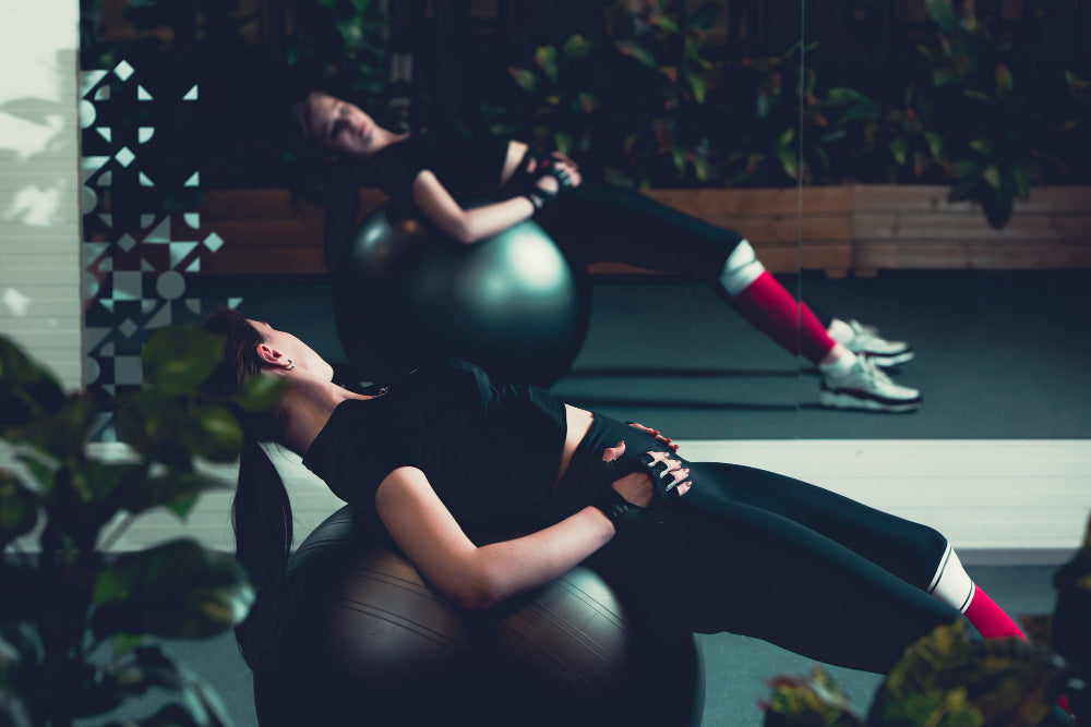 woman-working-out-on-fitness-ball