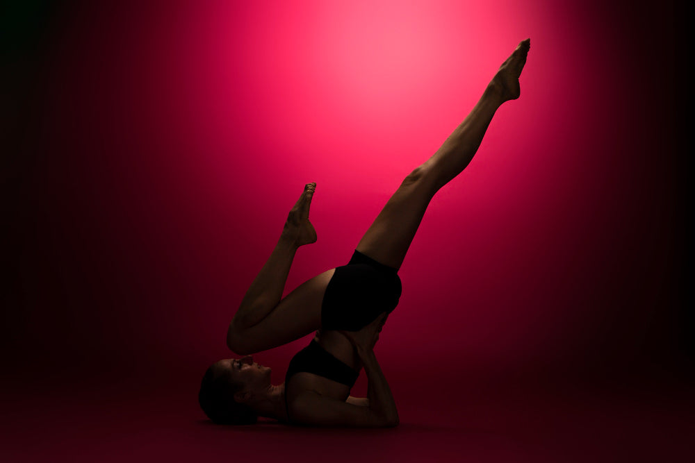 woman-working-out-with-red-light-on-the-background
