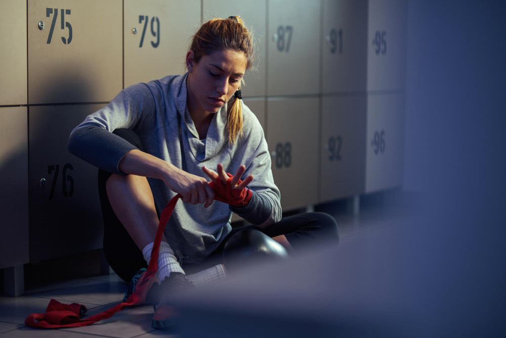 woman-in-locker-getting-ready-to-do-sport